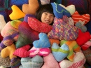 Buried by Knitted Pillows