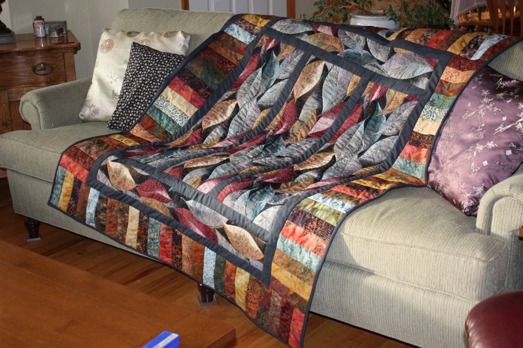 Falling Leaf Quilt on a Sofa jigsaw puzzle in Handmade puzzles on TheJigsawPuzzles.com