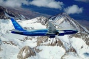 Boeing 777-200LR Banking over Mountain
