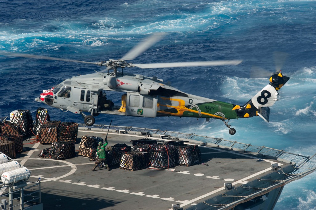 Sea Hawk Helicopter Picks Up Supplies jigsaw puzzle in Aviation puzzles on TheJigsawPuzzles.com