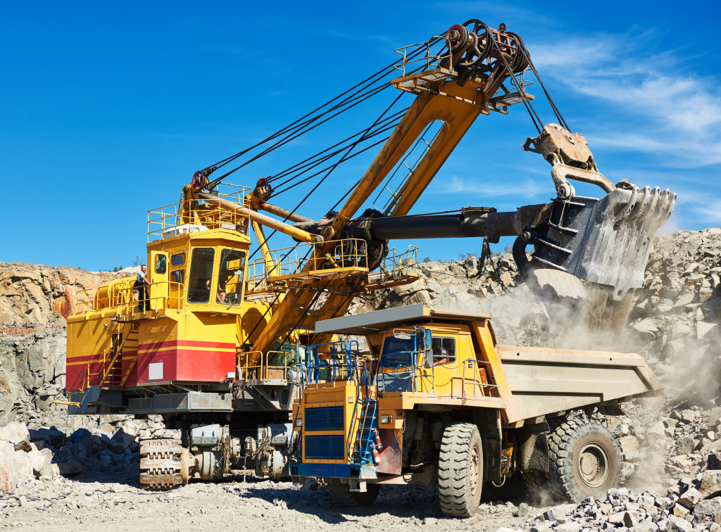 Excavator Loading a Dump Truck jigsaw puzzle in Cars & Bikes puzzles on TheJigsawPuzzles.com