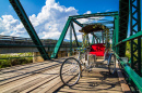 Tricycle on a Wooden Bridge