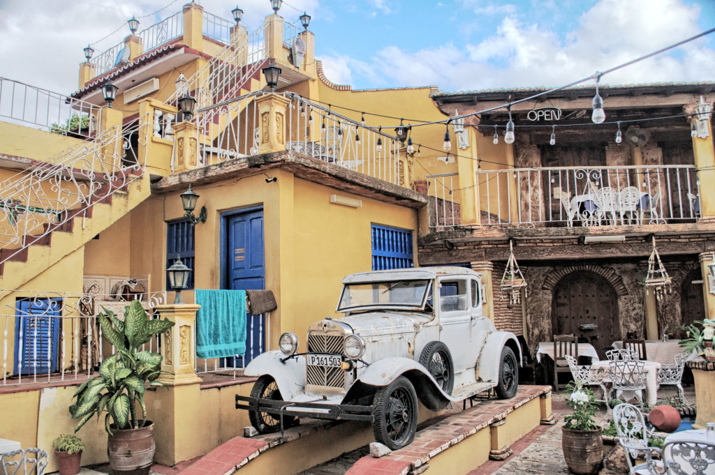 Retro Car in a Patio in Trinidad, Cuba jigsaw puzzle in Cars & Bikes puzzles on TheJigsawPuzzles.com