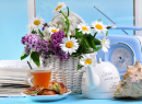 Tea with Flowers on the Blue Background