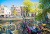 Amsterdam Canal Scene with Bicycles and Bridges