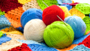 Yarn Balls and a Crocheted Blanket