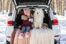 A Girl with a White Samoyed Dog