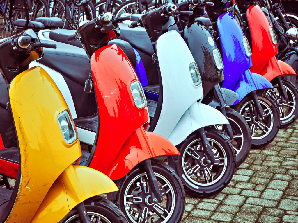 A row of Colorful Electric Mopeds jigsaw puzzle in Cars & Bikes puzzles on TheJigsawPuzzles.com