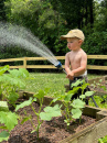 baby watering garden