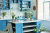 Blue Kitchen Interior with Flowers