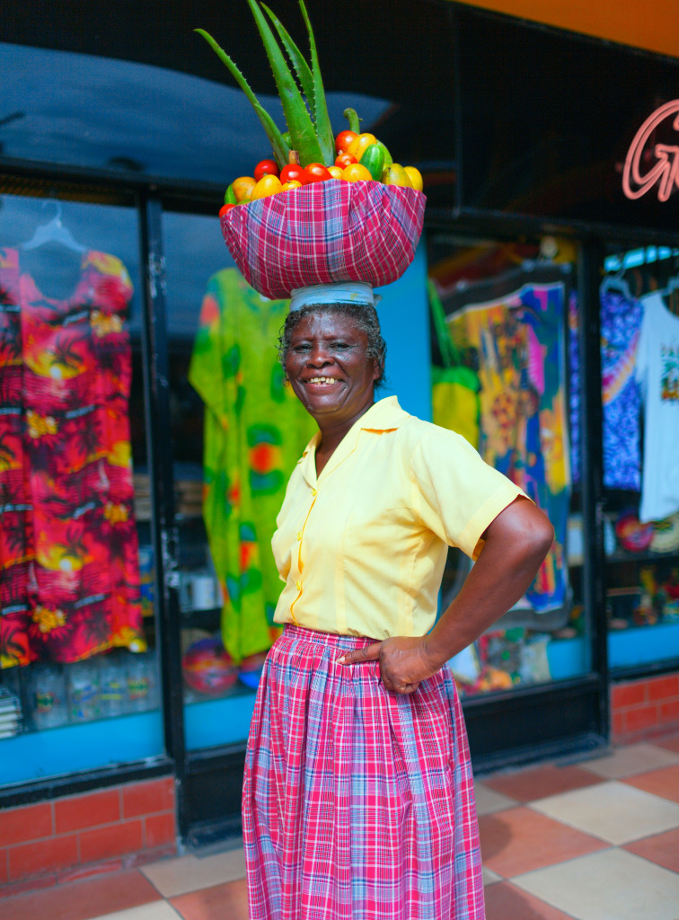 Happy Jamaican Woman with a Fruit Basket jigsaw puzzle in People puzzles on TheJigsawPuzzles.com