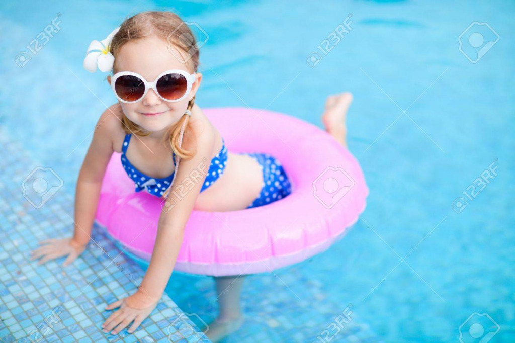 16521054-adorable-little-girl-with-inflatable-ring-at-swimming-pool jigsaw puzzle in PJ Hunter puzzles on TheJigsawPuzzles.com