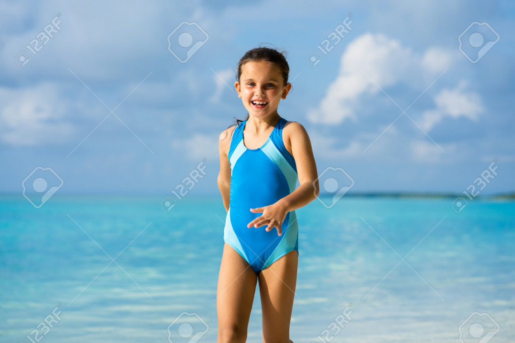 195849979-happy-child-having-fun-on-beach-playful-kid-person jigsaw puzzle in PJ Hunter puzzles on TheJigsawPuzzles.com