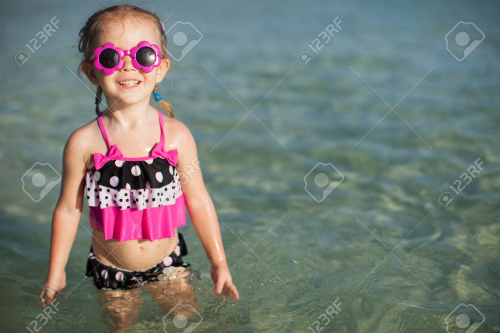 19978369-adorable-little-girl-on-tropical-beach-vacation jigsaw puzzle in PJ Hunter puzzles on TheJigsawPuzzles.com