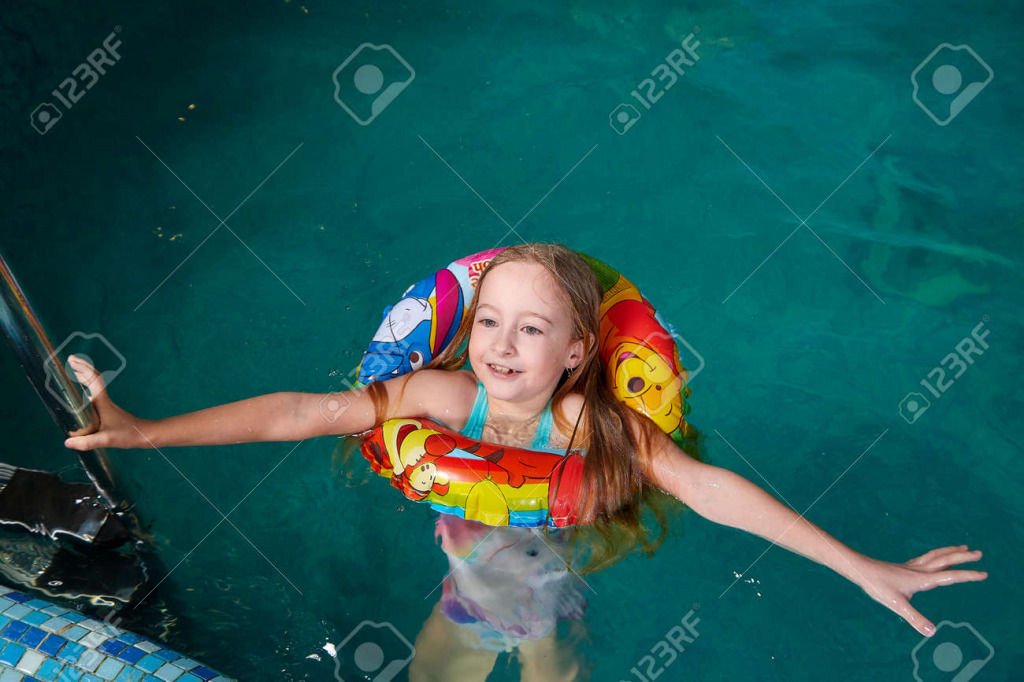 180560694-nice-child-swiming-in-blue-small-pool-girl-have-fun-in-water-indoors jigsaw puzzle in PJ Hunter puzzles on TheJigsawPuzzles.com