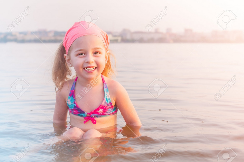 197693408-a-child-in-a-swimsuit-in-the-water-in-the-summer-a-little-girl-is-bathing-in-the-river-in-the-city jigsaw puzzle in PJ Hunter puzzles on TheJigsawPuzzles.com