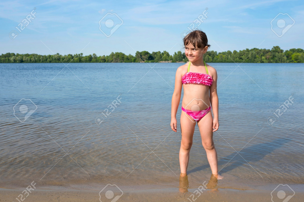 171745489-little-girl-in-a-pink-bathing-suit-on-the-river-on-a-sunny-warm-day jigsaw puzzle in PJ Hunter puzzles on TheJigsawPuzzles.com