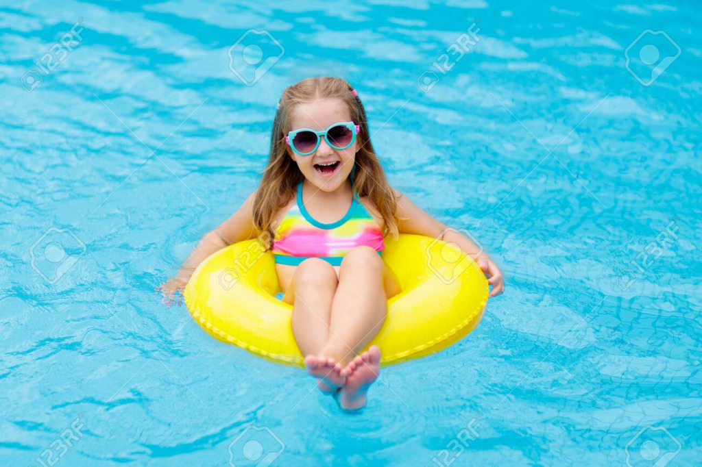 154569448-child-in-swimming-pool-floating-on-toy-ring-kids-swim-colorful-yellow-float-for-young-kids-little jigsaw puzzle in PJ Hunter puzzles on TheJigsawPuzzles.com