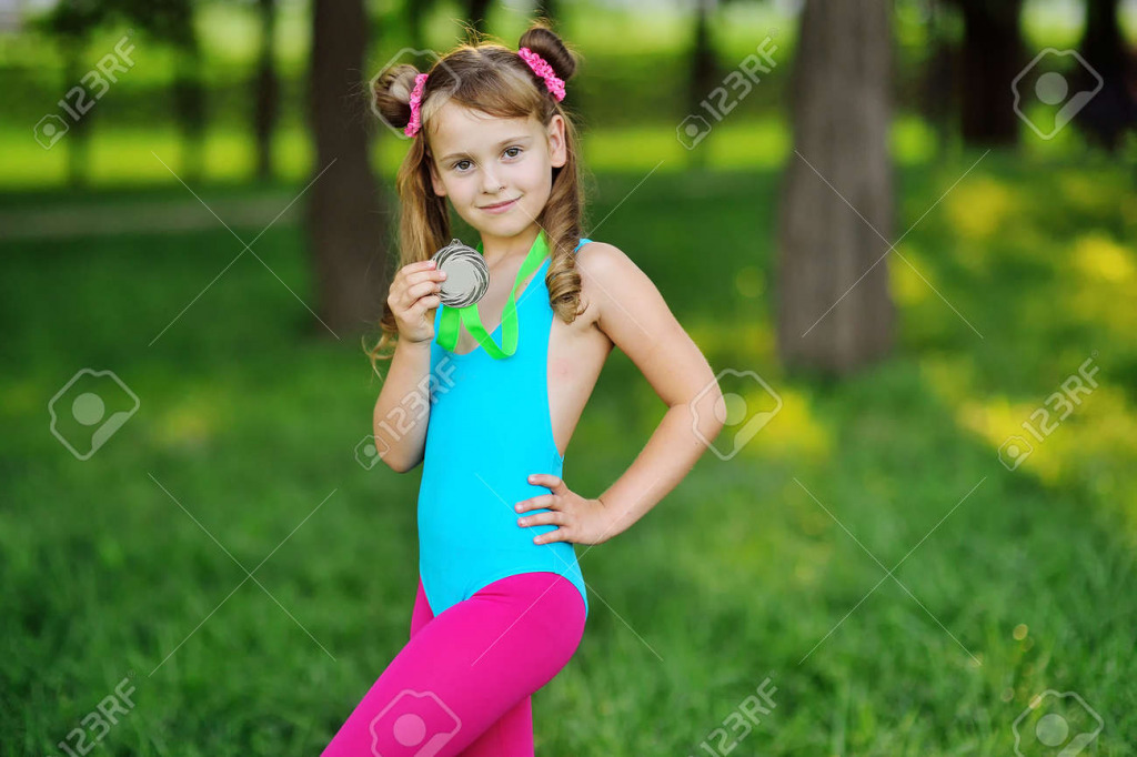 181328580-a-girl-in-a-gymnastic-swimsuit-with-a-medal-around-her-neck-childrens-sports jigsaw puzzle in PJ Hunter puzzles on TheJigsawPuzzles.com