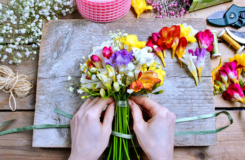 Florist Making a Bouquet of Freesia Flowers jigsaw puzzle in Flowers puzzles on TheJigsawPuzzles.com