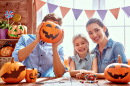 Happy Family Preparing for Halloween