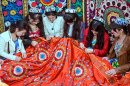 Girls Embroider a Carpet in Tajikistan