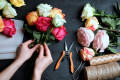 Florist Arranges Bouquet of Roses