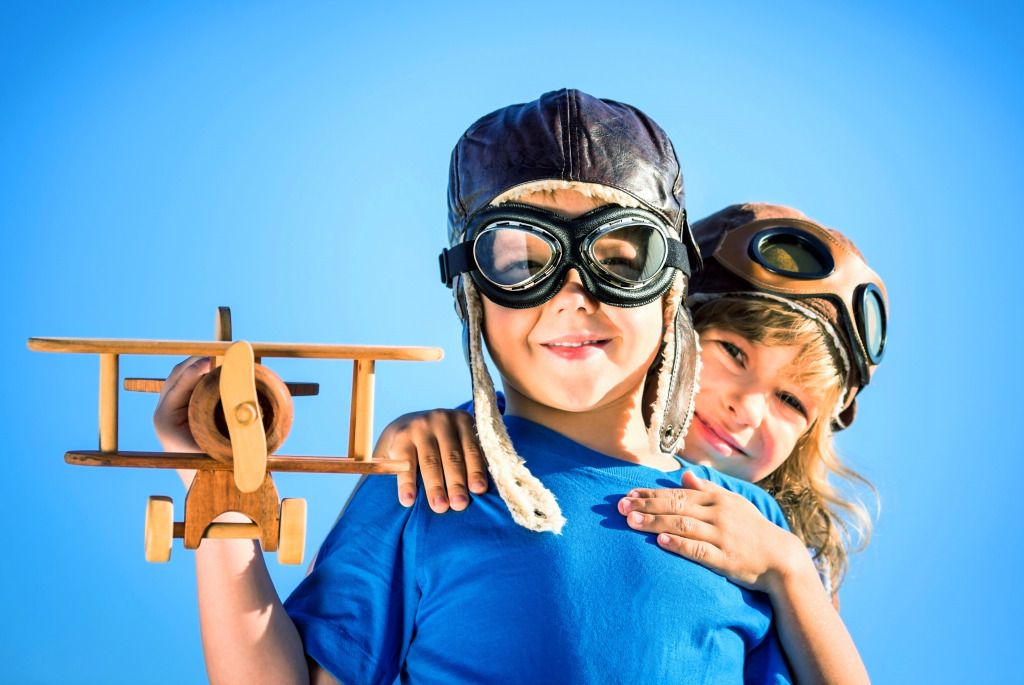 Happy Children Playing with a Wooden Airplane jigsaw puzzle in Aviation puzzles on TheJigsawPuzzles.com