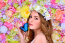 Young Woman in Flower Wreath with a Butterfly