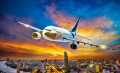Airplane Flying over a City at Sunset