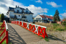 A Wooden Bridge over a River in Leba, Poland