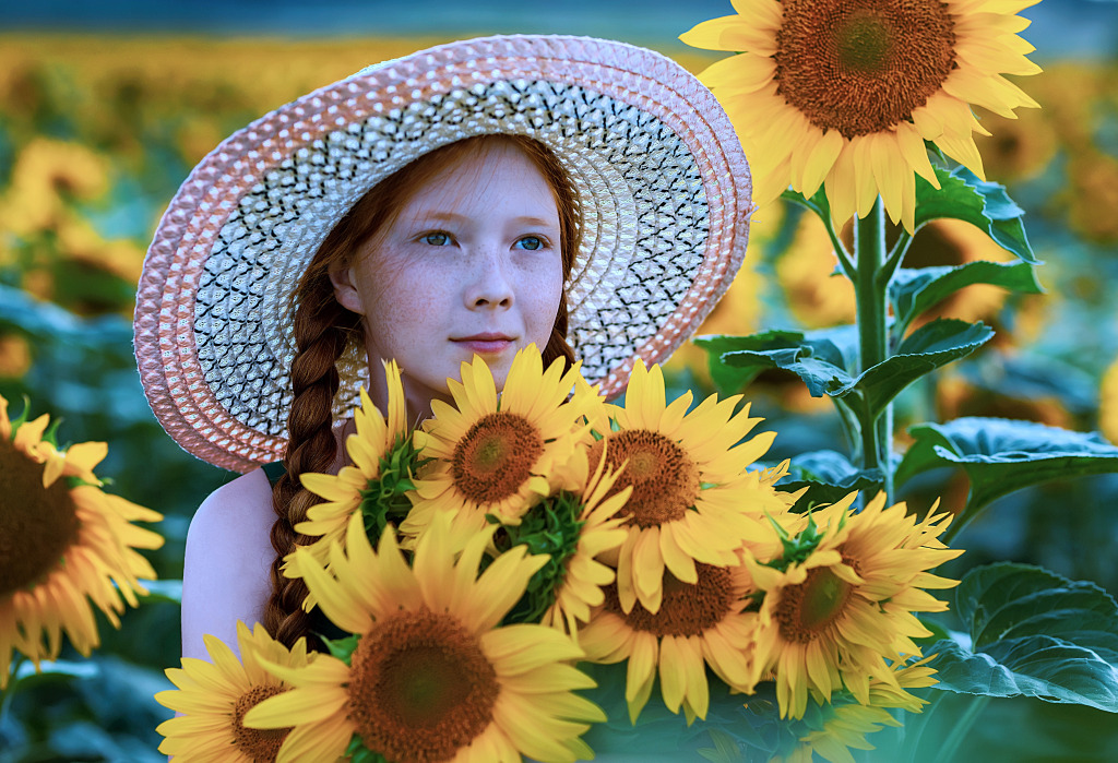 Beautiful Red-Haired Girl in a Field of Sunflowers jigsaw puzzle in Flowers puzzles on TheJigsawPuzzles.com