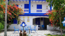 Tourist Attraction In the City of Batu With A Traditional Greek House Theme With Beautiful Flowers. Traditional Greek House Faca