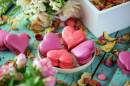 Heart-Shaped Macarons on a Wooden Background