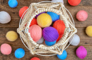 White Knitted Basket and Colorful Yarn Balls