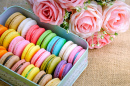 Close-Up of Colorful Macarons and Roses